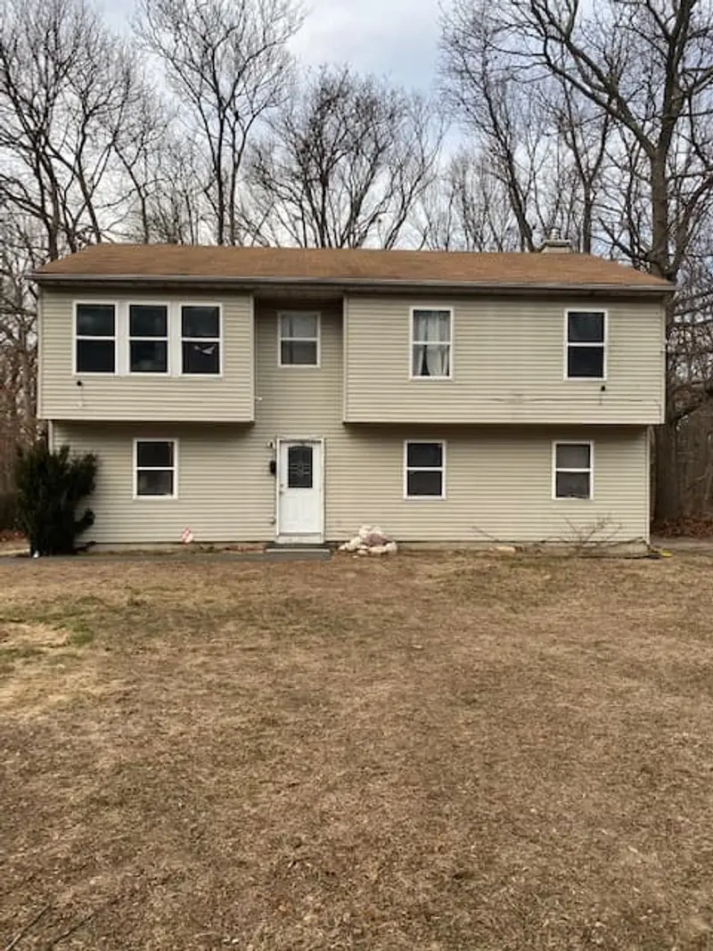 Two-story raised ranch on a wooded lot, Middle Island, NY